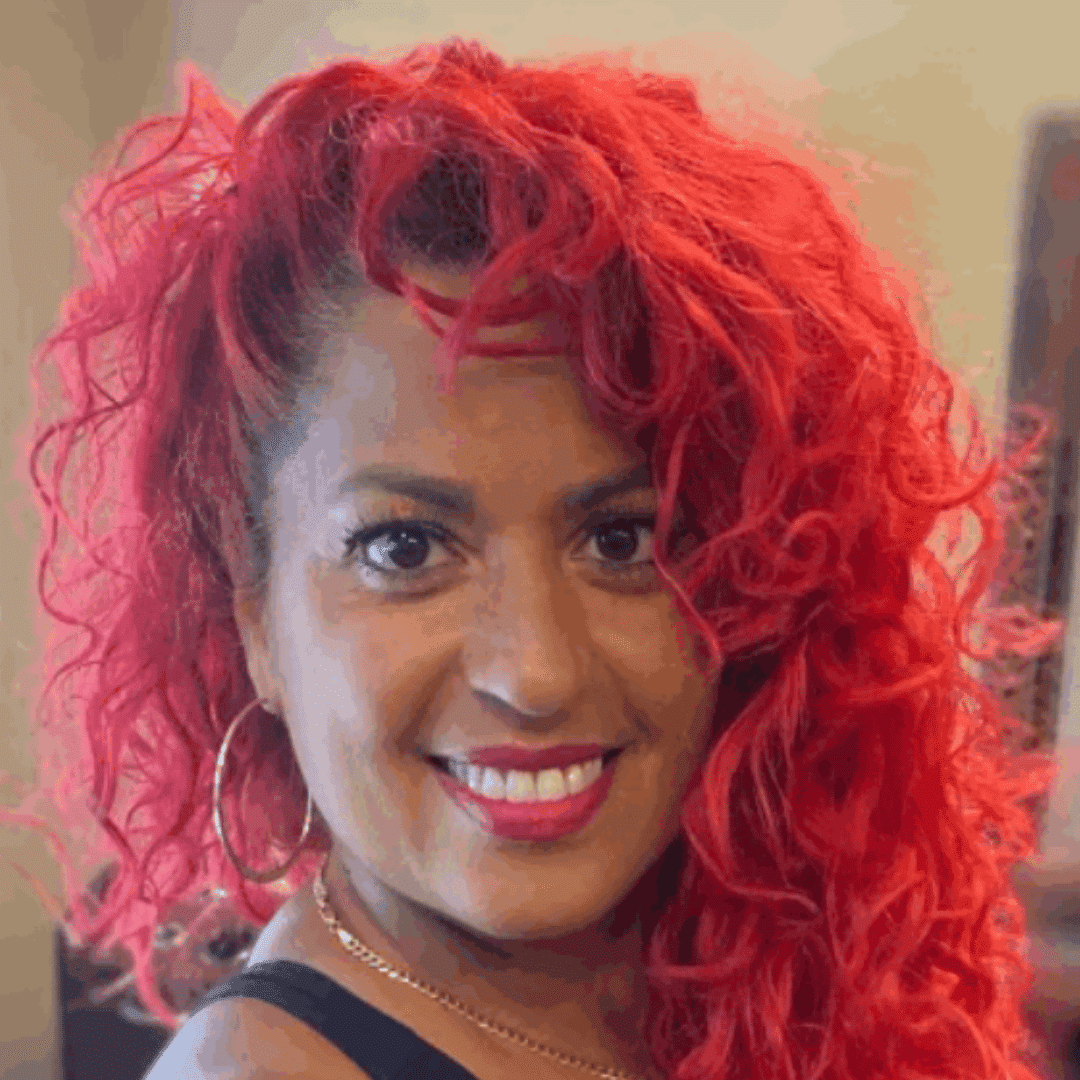 Portrait of Wally Hernandez, a professional stylist at Head 2 Toe, showcasing their expertise and style.